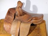 a wooden box with a pair of cowboy boots on top of it