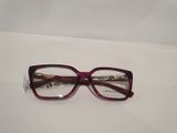 purple glasses on a white surface with a white background
