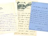 a group of three old letters sitting on top of each other