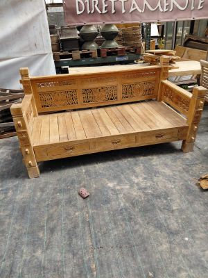 a wooden bench that is sitting in the middle of a room