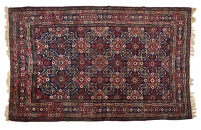 an antique persian rug with a floral design and fringe fringes