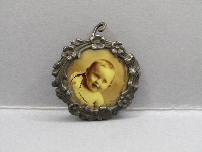 a close up of a picture of a baby in a picture frame