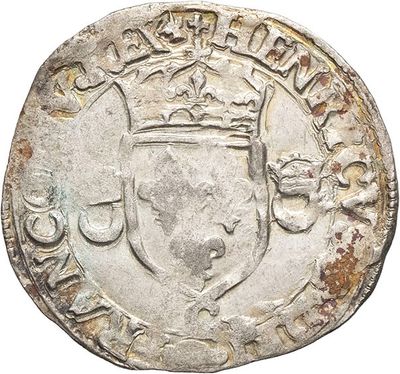 a silver coin with a crown on top of it