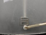 a metal container with a metal handle and a wire