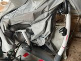 a bike that is covered with a sheet in a garage
