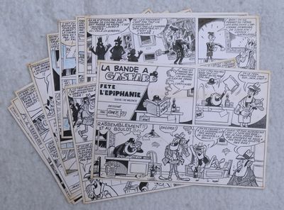 several old comic books are stacked on top of each other