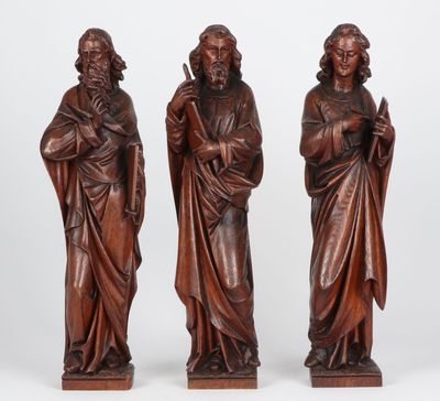 three carved wood figures of jesus and mary