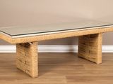 an image of a coffee table with a glass top on a wooden floor