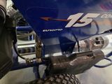 a close up of a blue motorcycle with a number 15 on it