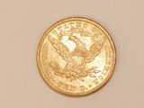 an image of a gold coin on a white surface