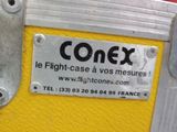 a sign on the side of a yellow piece of luggage