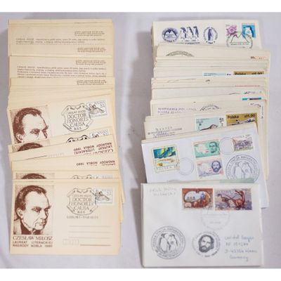 several envelopes with stamps and stamps on them sitting on a table