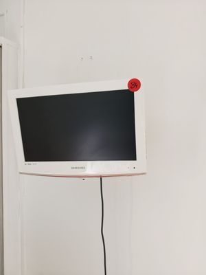 a television that is sitting on a stand in a room