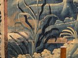 a picture of a tapestry hanging on a wall