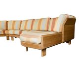 a wooden couch with a striped cushion on it