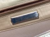 the zipper of a purse is open on the bed