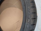 a tire that is sitting on top of a cardboard box