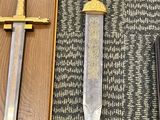 a knife that is laying on the floor next to a knife