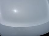 a close up of a white chair in a room