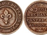 a close up of a coin on a white background