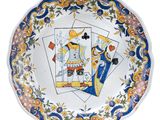 an image of a decorative plate with playing cards on it
