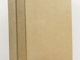 a brown cardboard box sitting on top of a white surface