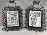 two framed pictures of a dog and a cat hanging on a wall