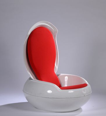 a white and red chair with a red seat on it