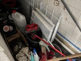 an image of a bathroom with a lot of clutter on the floor