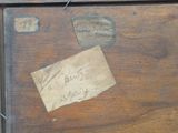 a piece of paper that has been left on a piece of wood