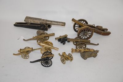 several different types of toy guns and cannon on a white surface