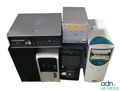 a lot of computers and a printer sitting on top of each other