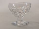 a clear glass bowl sitting on top of a table