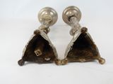 pair of silver plated candlesticks with ornate design