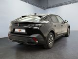 the rear end of a black toyota c - hr parked in a garage