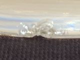 a close up of a white plate with a flower on it