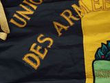 an image of a close up of a flag with a ribbon on it
