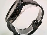 a close up of a watch on a stand
