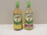 two bottles of celerie are sitting on a white table