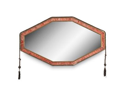 an image of a decorative mirror with tassels hanging from it
