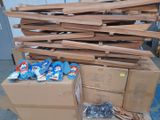 a pile of boxes and a pile of shoes on the floor