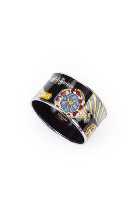 a close up of a ring with a flower design on it