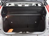 a trunk of a red car with its doors open