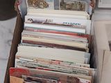a lot of books in a box on the table