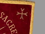 a red and gold flag with a cross on it