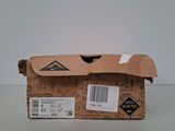 a cardboard box with a sticker on it sitting on a table
