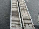 two metal ramps on the side of the road