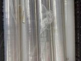 many rolls of plastic wrapped up in a crate