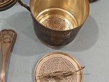 many different types of kitchen utensils sitting on a table