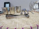 a basket with silverware on top of it on a table